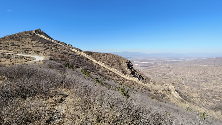 Great Wall on bluffs and cliffs near the village
