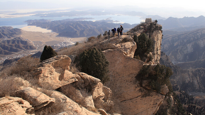 Hikers on the cliffs near the tower